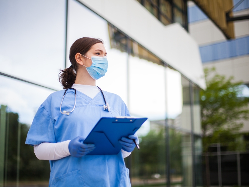 Doctor in front of hospital