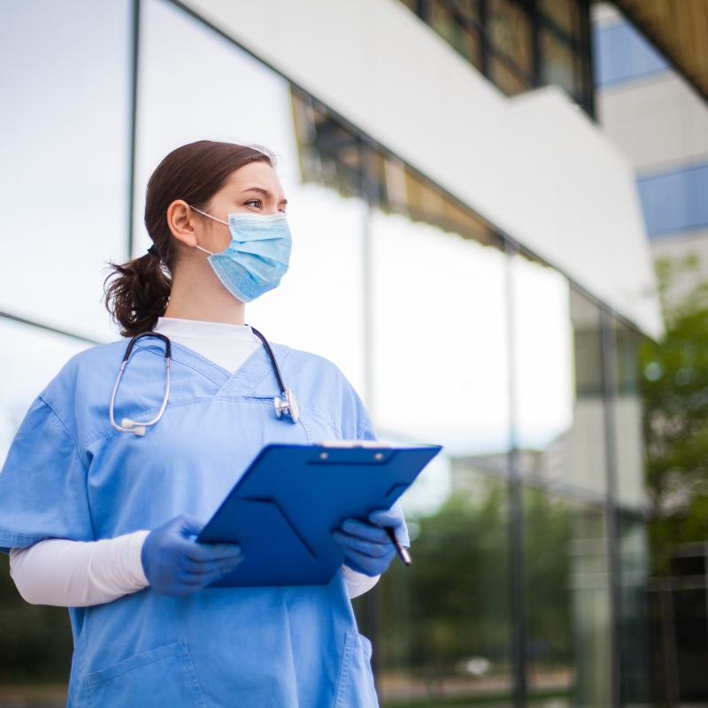 Doctor in front of hospital