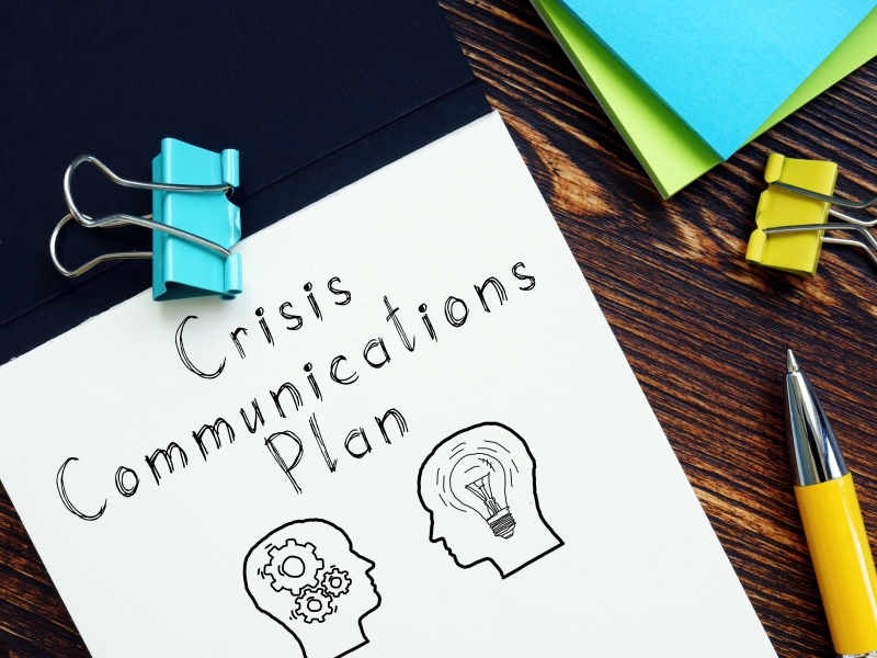 Crisis Communications Plan is shown on the photo using the text