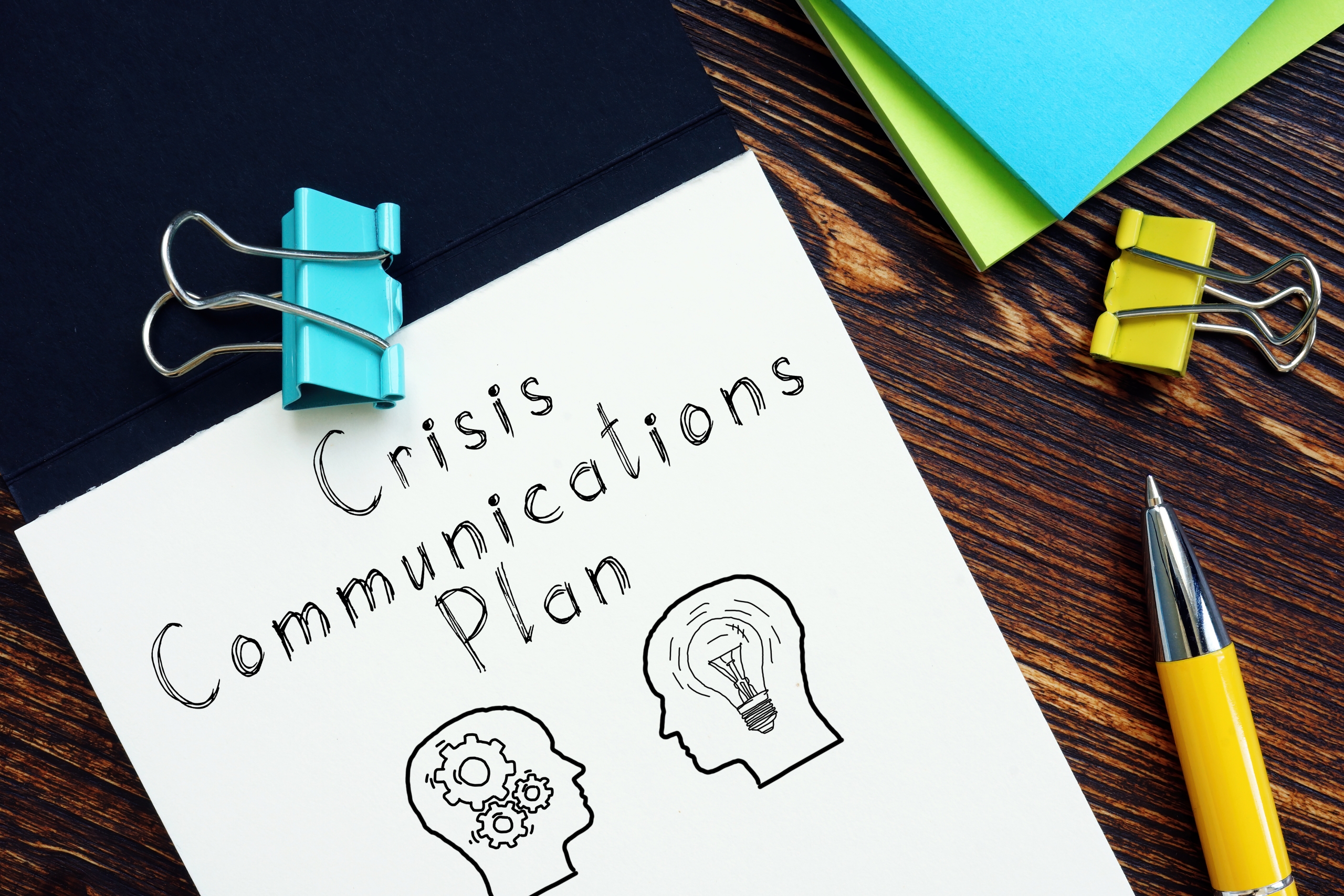 Crisis Communications Plan is shown on the photo using the text