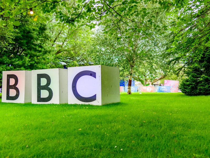 large bbc sign in park with grass and trees