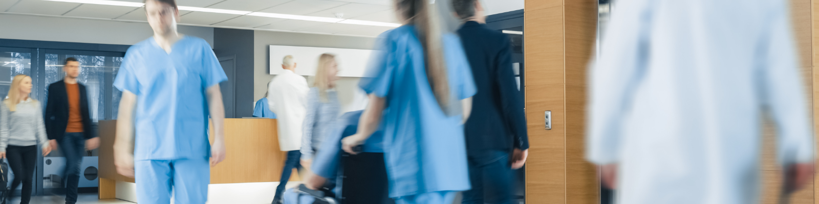 Busy hospital with people walking through