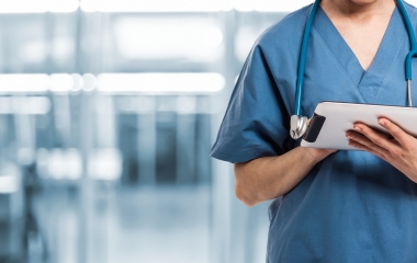 A Doctor using a digital tablet