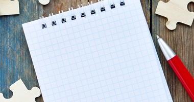 Notepad and puzzle pieces