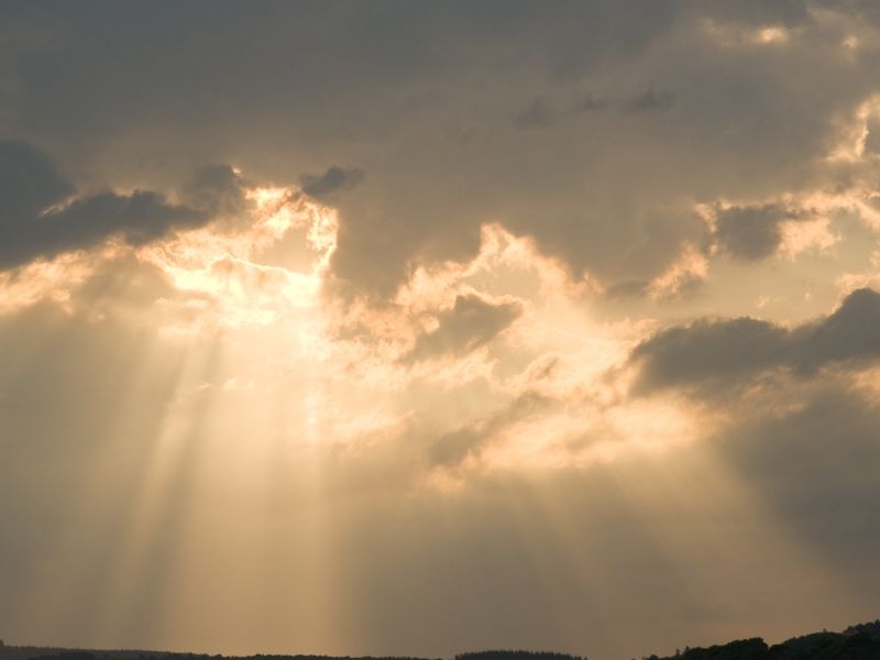 The Sun shining through clouds