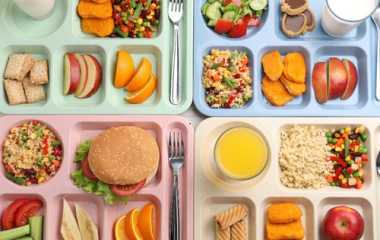 4 school lunches lined up next to one another