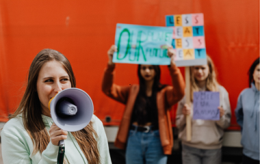 Campaigners with signs and a megaphone